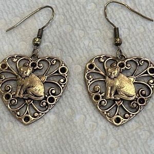 Cat lovers dream earrings. Beautiful filigree heart with a cat center. Brass
